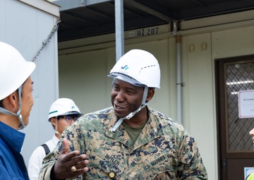Members of the Defense Policy Review Initiative, U.S. Army Corps of Engineers, and the Okinawa Defense Bureau tour construction for new base housing