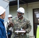 Members of the Defense Policy Review Initiative, U.S. Army Corps of Engineers, and the Okinawa Defense Bureau tour construction for new base housing