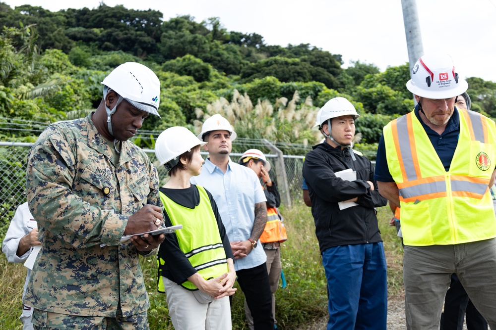 Members of the Defense Policy Review Initiative, U.S. Army Corps of Engineers, and the Okinawa Defense Bureau tour construction for new base housing