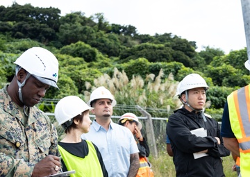 Members of the Defense Policy Review Initiative, U.S. Army Corps of Engineers, and the Okinawa Defense Bureau tour construction for new base housing