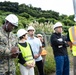 Members of the Defense Policy Review Initiative, U.S. Army Corps of Engineers, and the Okinawa Defense Bureau tour construction for new base housing