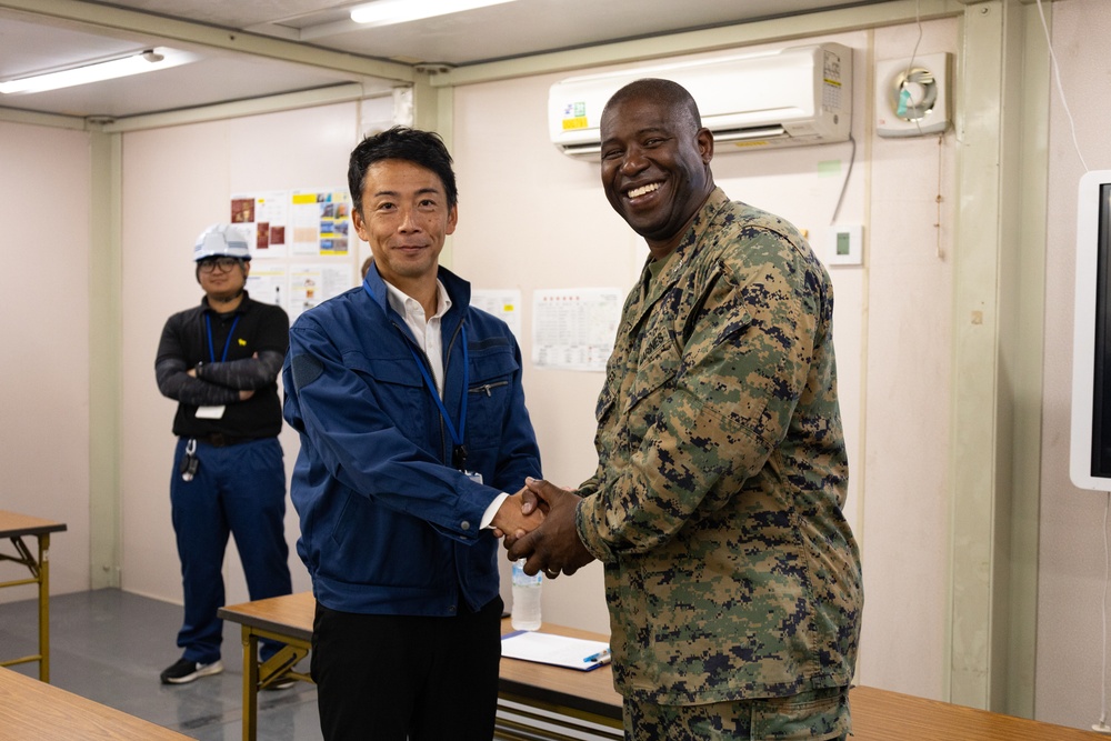 Members of the Defense Policy Review Initiative, U.S. Army Corps of Engineers, and the Okinawa Defense Bureau tour construction for new base housing