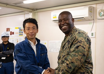 Members of the Defense Policy Review Initiative, U.S. Army Corps of Engineers, and the Okinawa Defense Bureau tour construction for new base housing