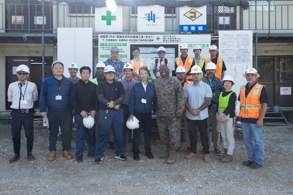 Members of the Defense Policy Review Initiative, U.S. Army Corps of Engineers, and the Okinawa Defense Bureau tour construction for new base housing