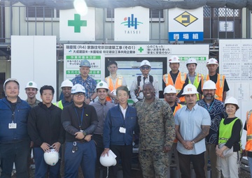 Members of the Defense Policy Review Initiative, U.S. Army Corps of Engineers, and the Okinawa Defense Bureau tour construction for new base housing