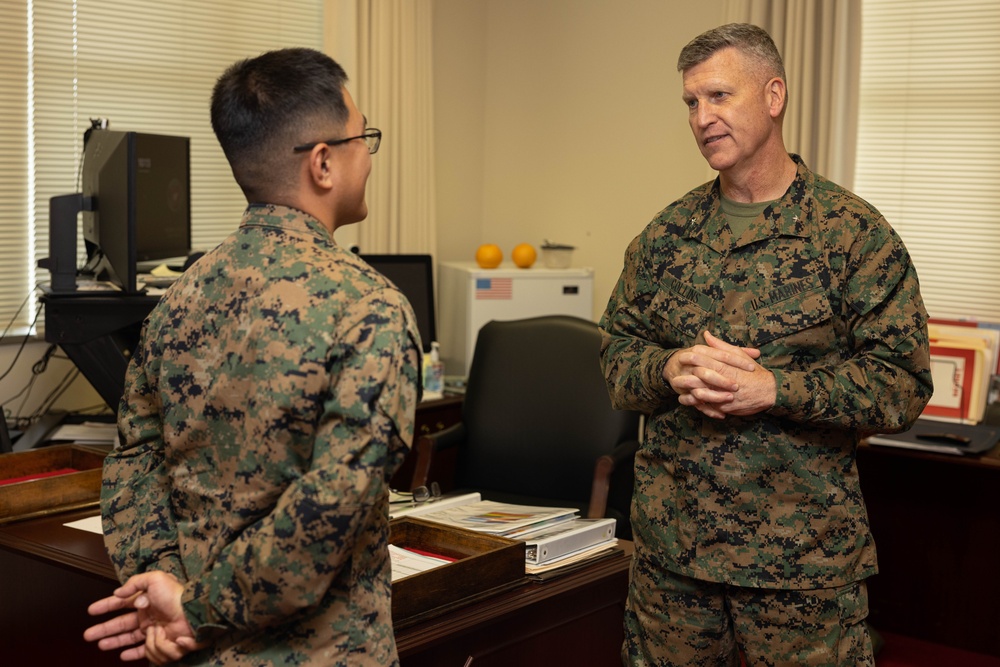 Brigadier General Collins Congratulates the Marine and NCO of the Quarter