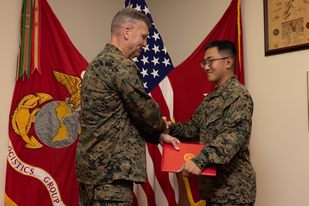 Brig. Gen. Collins Congratulates 3rd MLG Marine and NCO of the Quarter