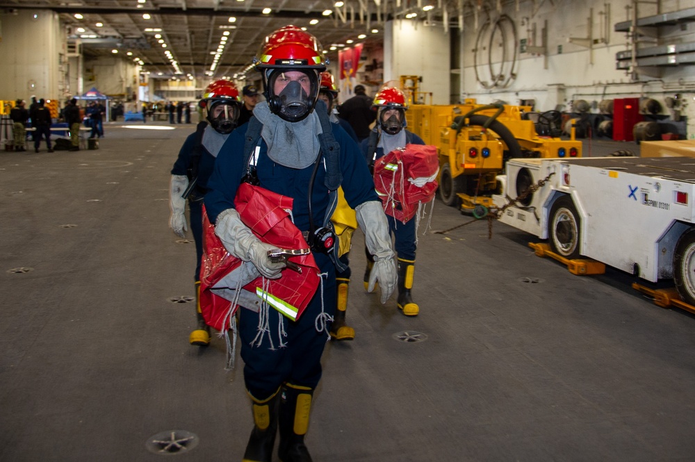 USS Ronald Reagan (CVN 76) Sailors participate in a damage control training drill