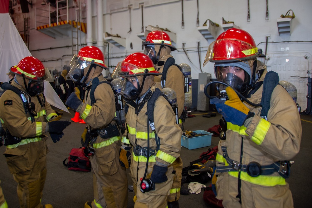 USS Ronald Reagan (CVN 76) Sailors participate in a damage control training drill