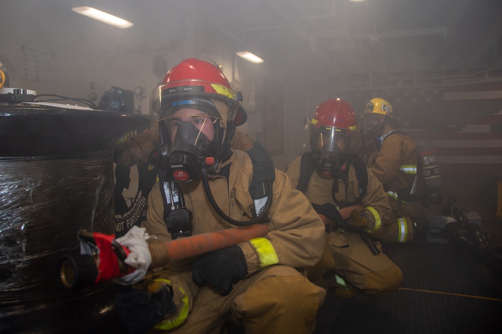 USS Ronald Reagan (CVN 76) Sailors participate in a damage control training drill