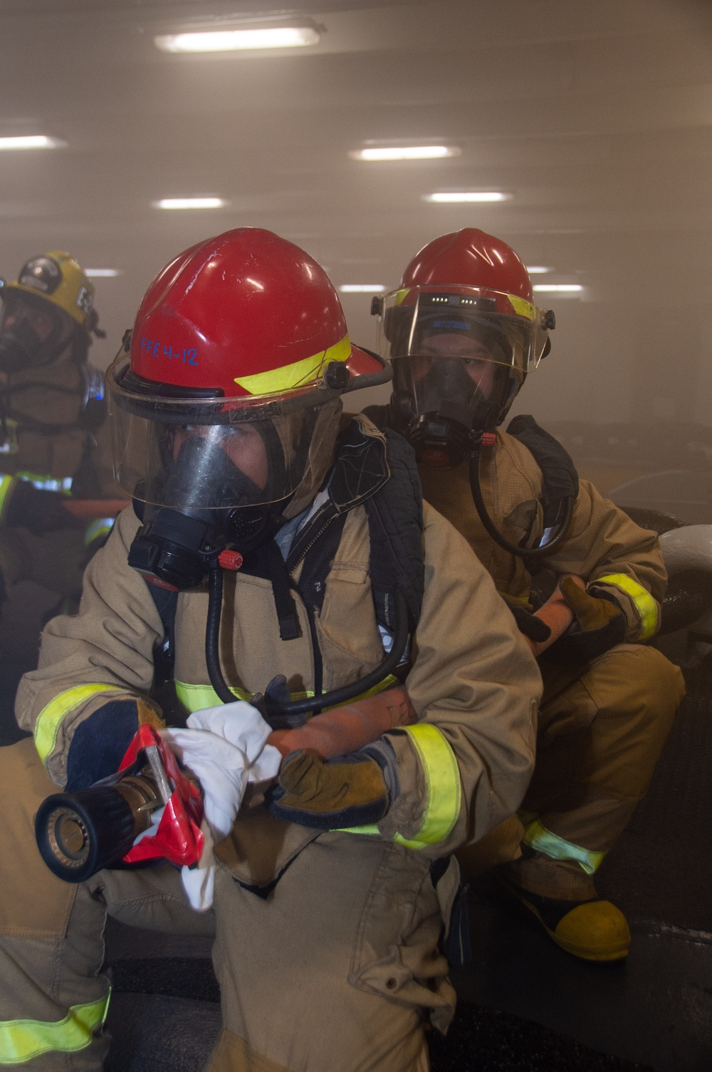 USS Ronald Reagan (CVN 76) Sailors participate in a damage control training drill