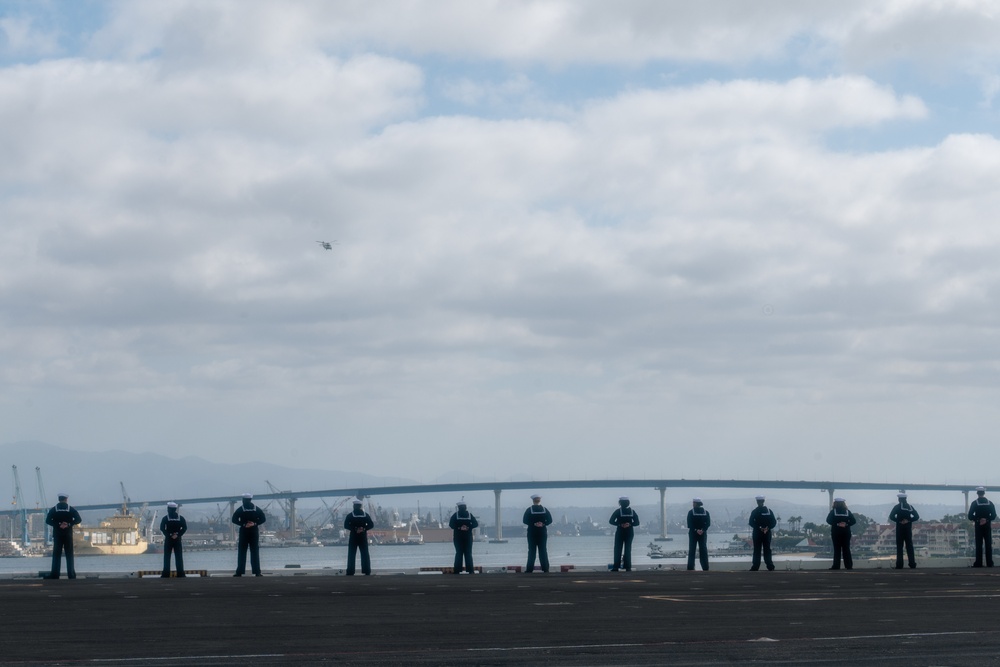 USS Carl Vinson (CVN 70) Sailors Man the Rails while departing San Diego