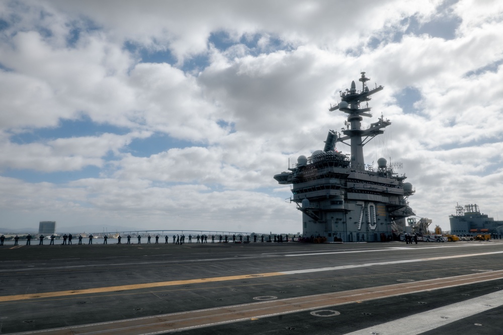 USS Carl Vinson (CVN 70) Sailors Man the Rails while departing San Diego