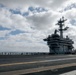 USS Carl Vinson (CVN 70) Sailors Man the Rails while departing San Diego