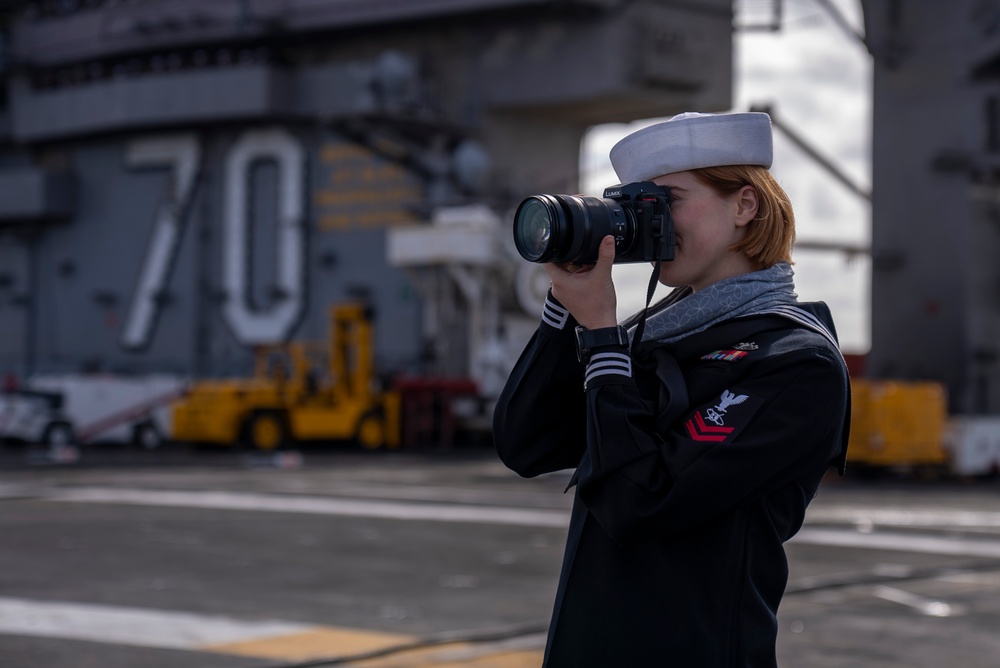 USS Carl Vinson (CVN 70) Sailors Man the Rails while departing San Diego