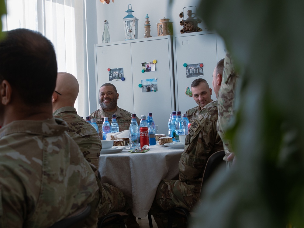 U.S. and partnered soldiers have lunch at the Romanian Dining Facility