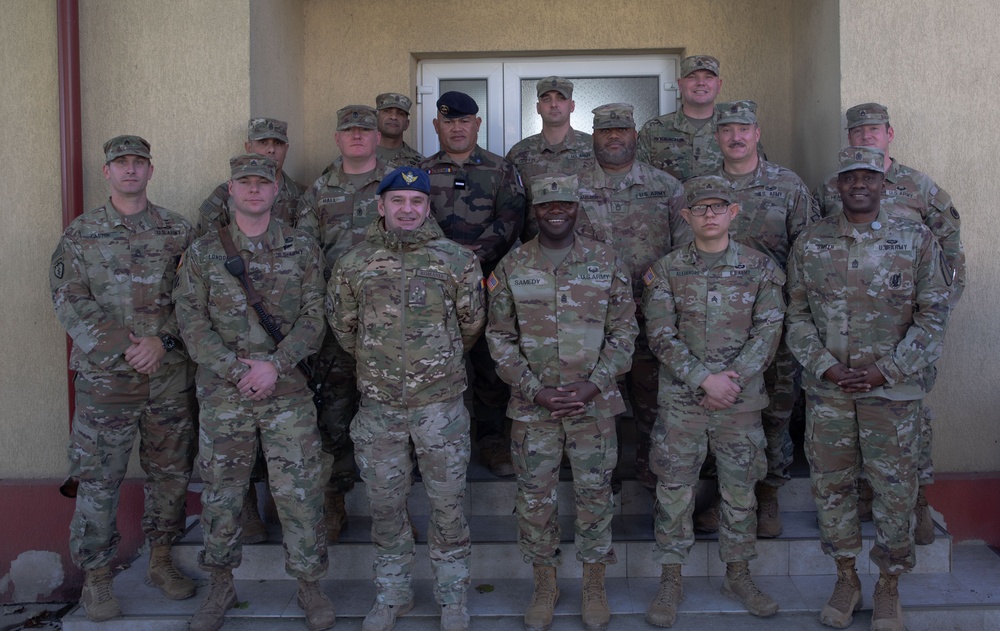 U.S. Soldiers and NATO allies pose for group picture