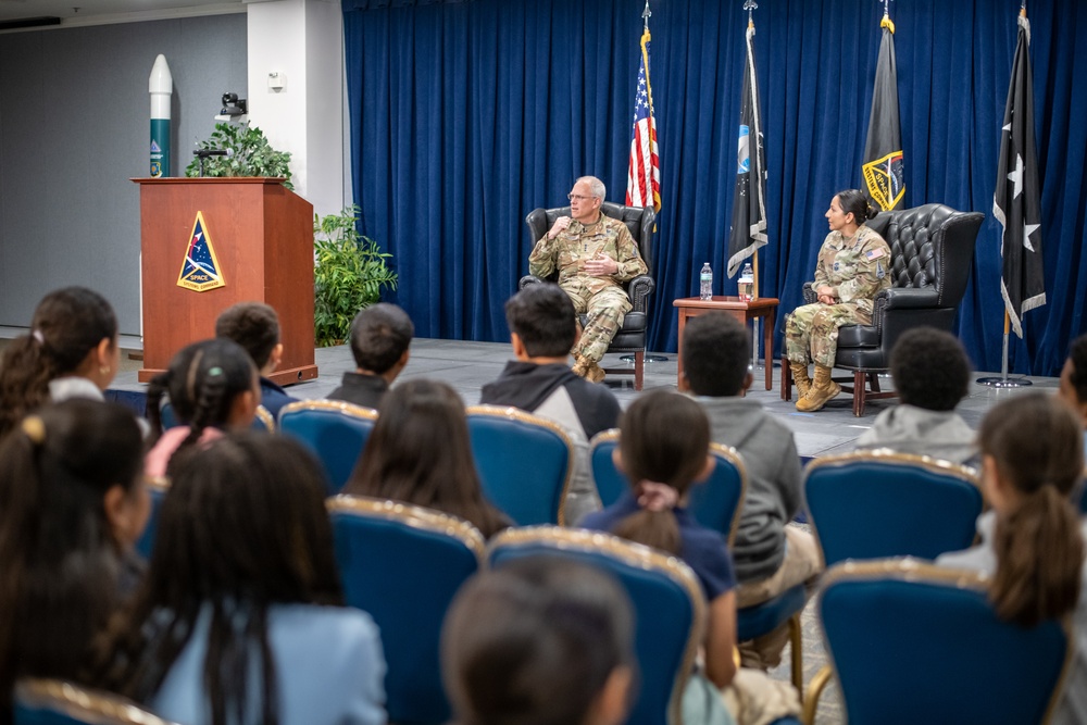 Lt. Gen. Philip Garrant and Chief Master Sgt. Jacqueline Sauvé participate in a Q&amp;A session with students from Ramona Elementary School