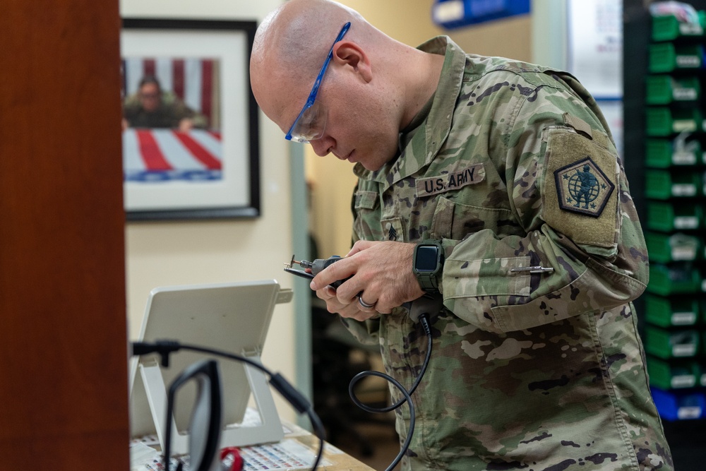 United States Army liaison case managers prepare uniform