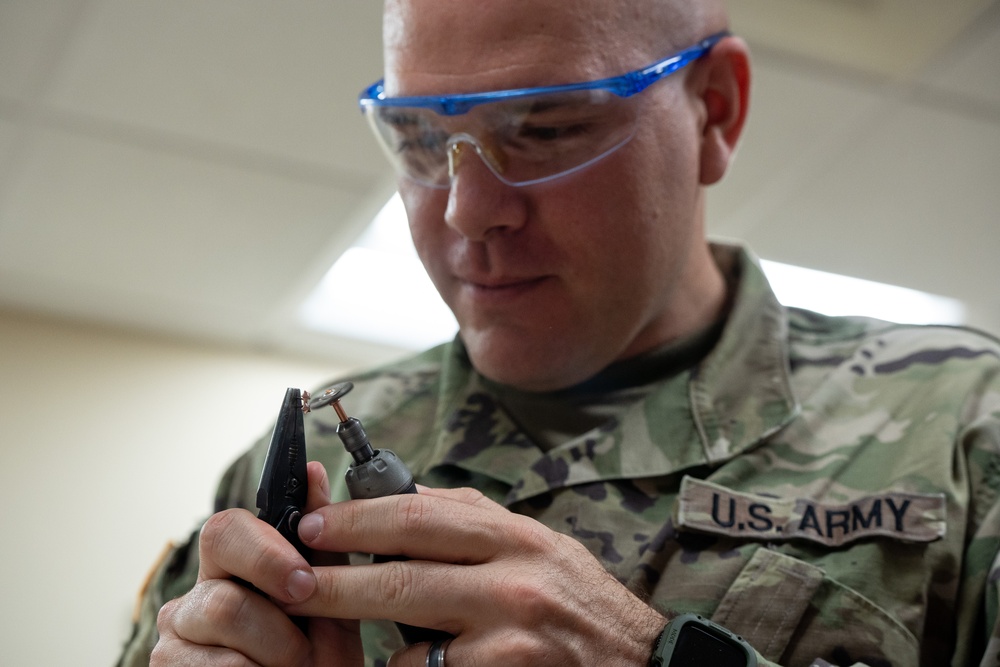 United States Army liaison case managers prepare uniform