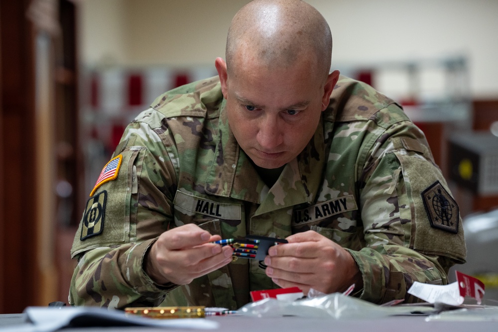 United States Army liaison case managers prepare uniform