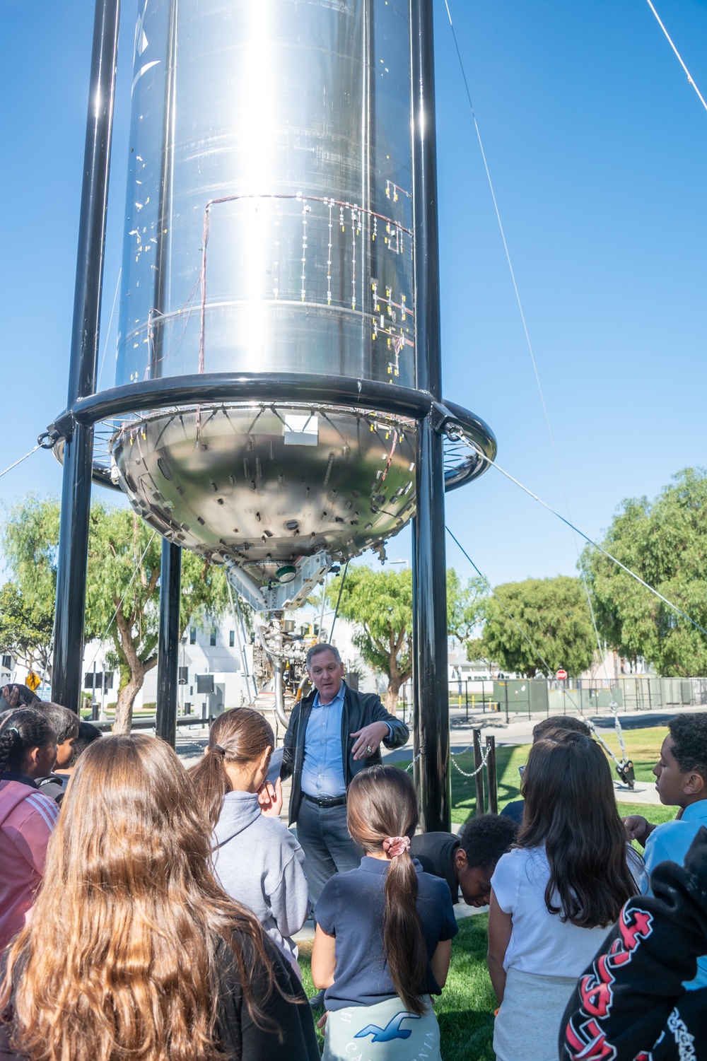 Lane Gilchrist, STEM Coalition president, gives a Los Angeles Air Force Base tour to Ramona Elementary students