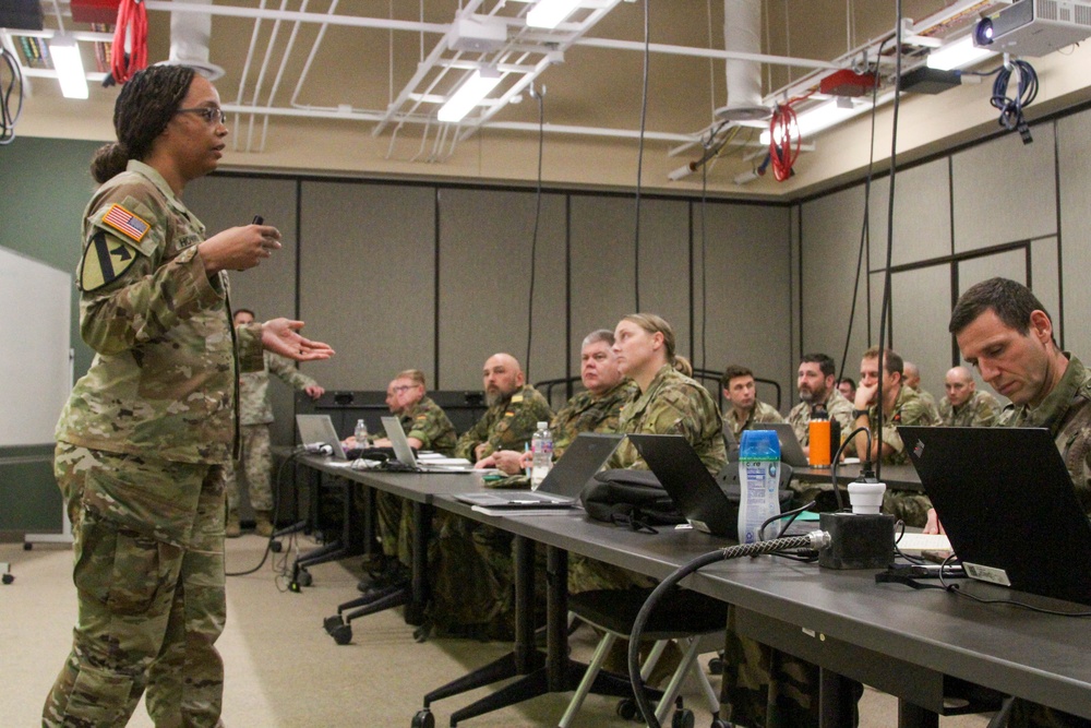 Logistics planner, briefs U.S., French and German planners during the III Armored Corps’ Final Planning Even