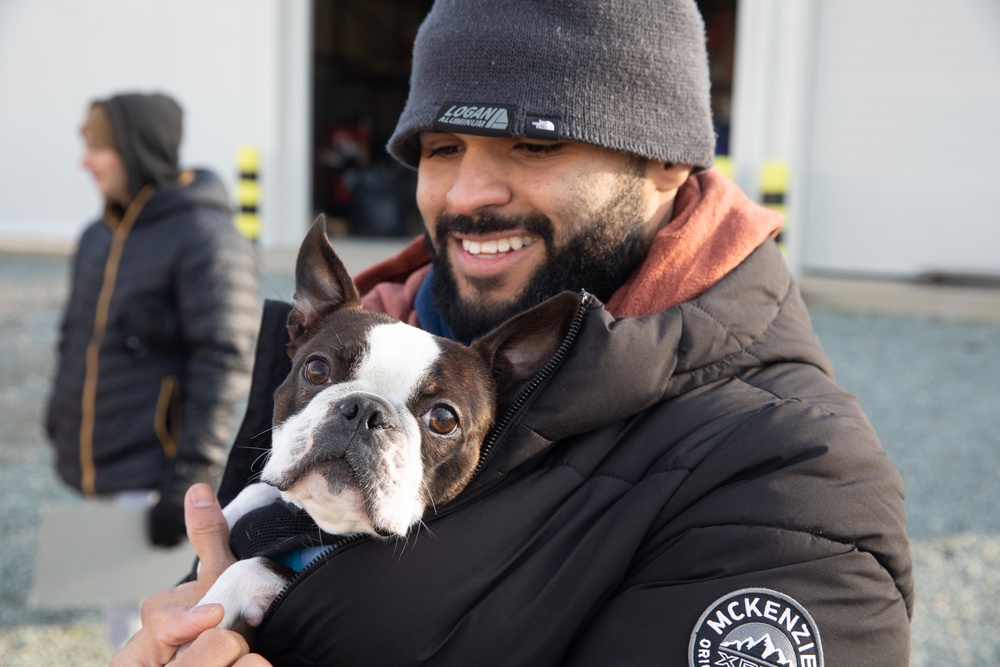 Felix Rodriguez holds a dog