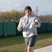 U.S. Soldier points at the camera as they run