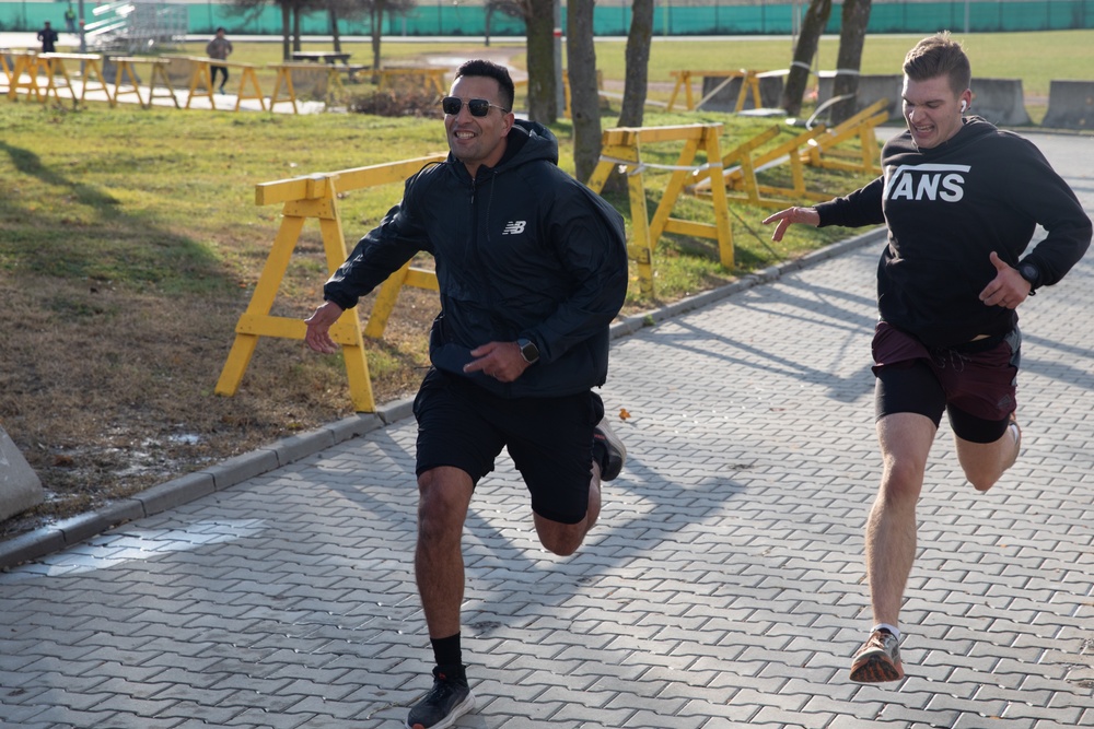 Runners sprint to the finish line at the Turkey Trot