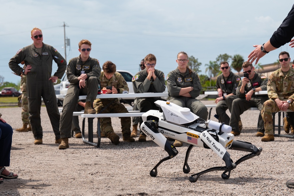 927th ARW Airmen view robotic dog demonstration