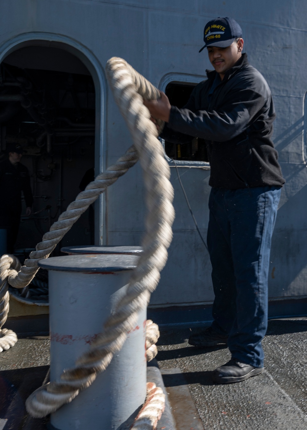 Nimitz Sailor Heaves Around Line