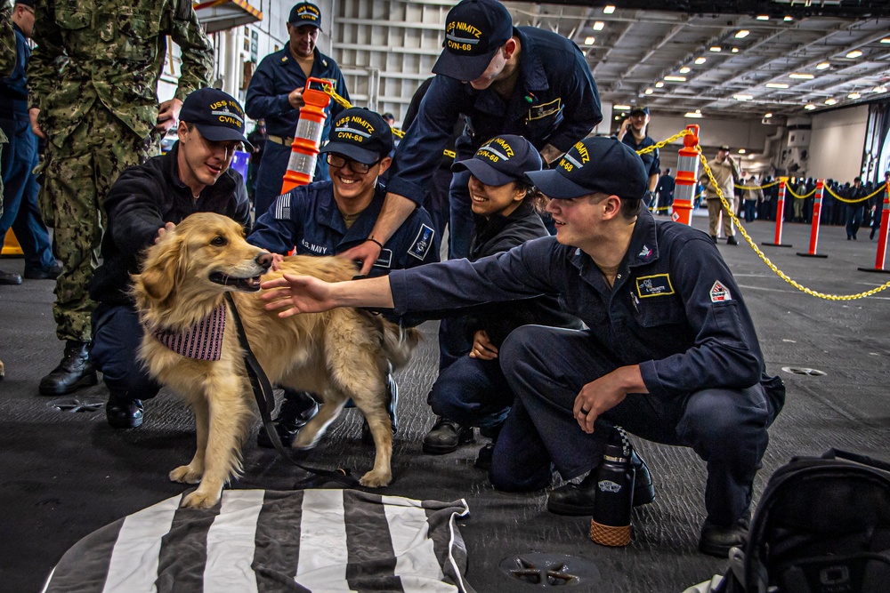 Nimitz Sailors Pet a Dog