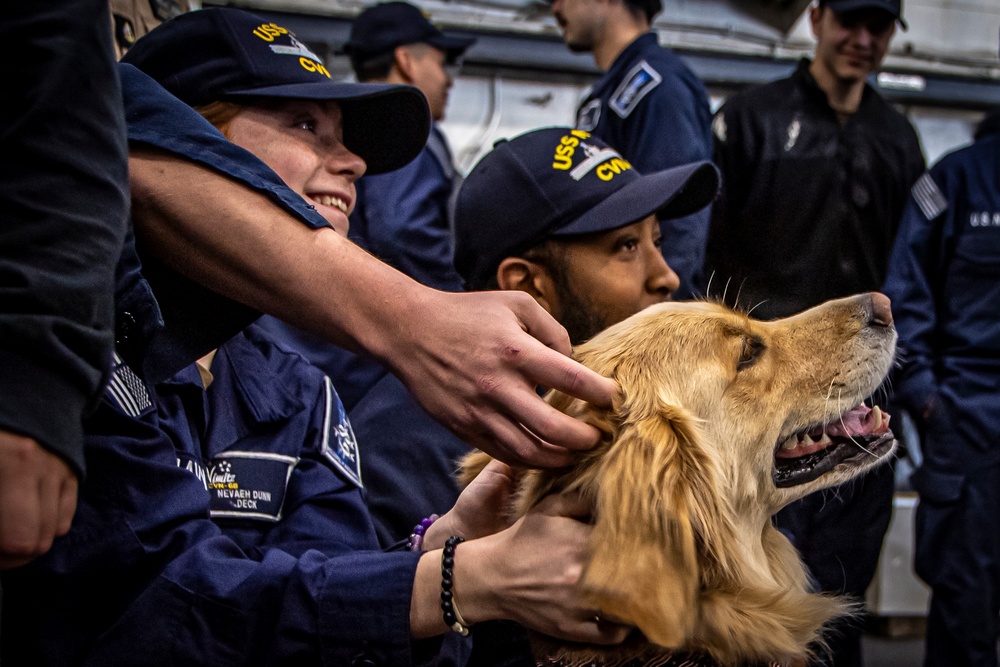 Nimitz Sailors Pet a Dog