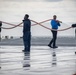 USS Tripoli Sailors wash the flight deck