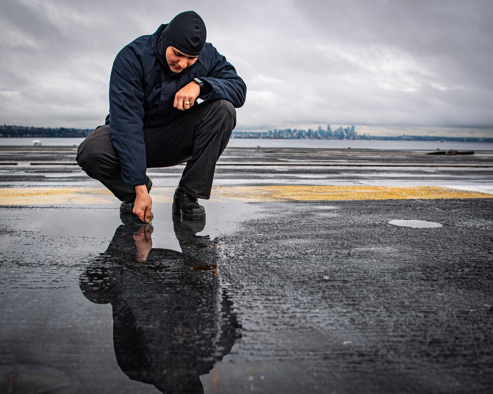 Nimitz Sailor Conducts Maintenance on Flight Deck Equipment