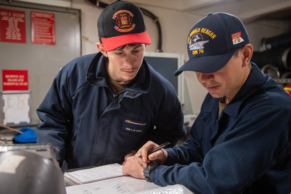 USS Ronald Reagan (CVN 76) Sailors perform daily operations