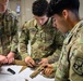 Army South leaders provide weapons familiarization to cadets before Ranger Challenge