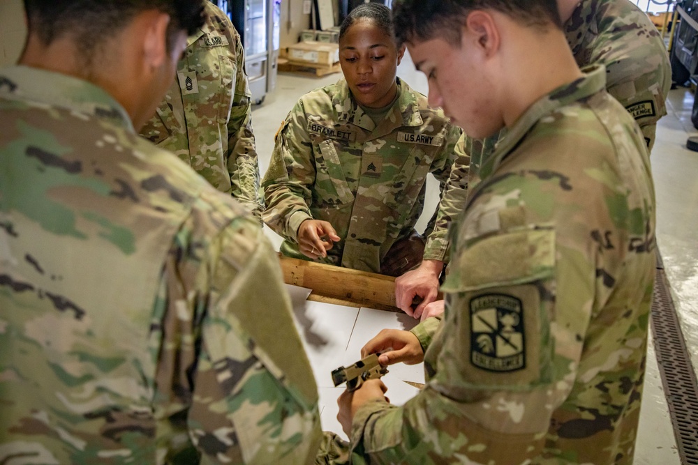 Army South leaders provide weapons familiarization to cadets before Ranger Challenge