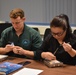 Two veterinarians from Veterinary Readiness Activity, Rheinland Pfalz practicing sutures