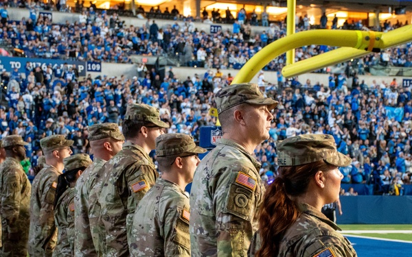 Indiana National Guard soldiers, airmen participate in pregame ceremonies at the Indianapolis Colts, Detroit Lions game