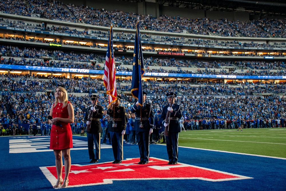 Indiana National Guard soldiers, airmen participate in pregame ceremonies at the Indianapolis Colts, Detroit Lions game