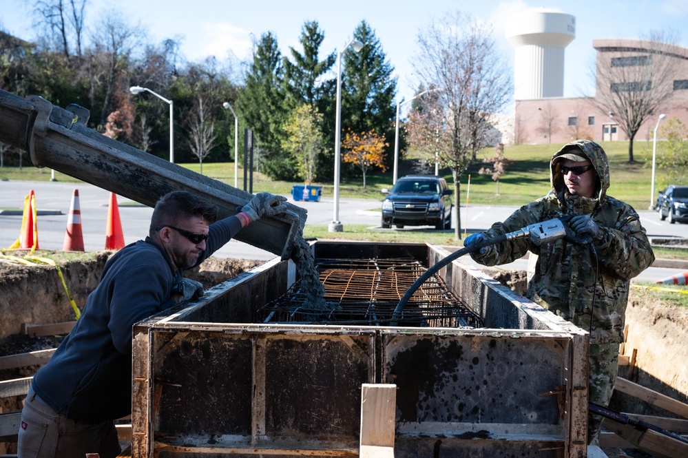 911th CES pours concrete for upcoming legacy monument