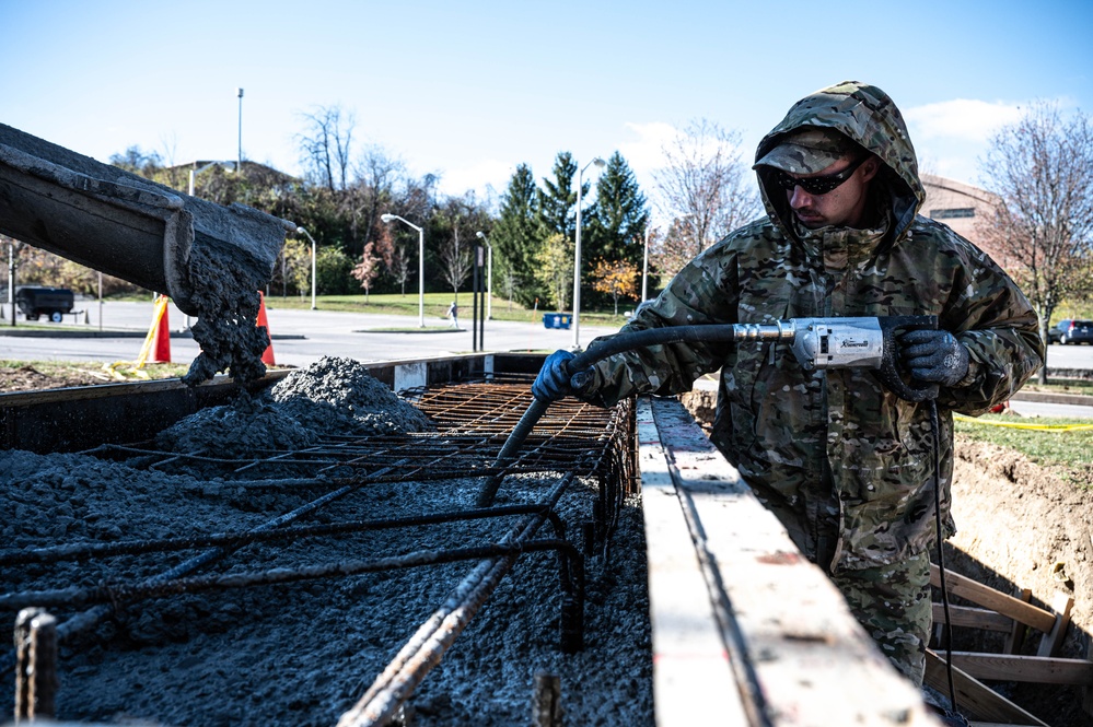 911th CES pours concrete for upcoming legacy monument