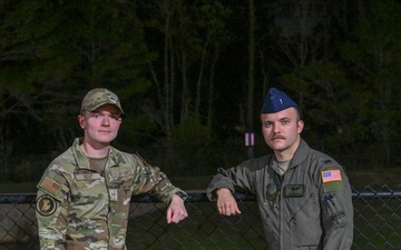 Airmen, civilians unite to save mother, son from submerged vehicle