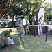 765th Transportation (Terminal) Bn. Soldiers, Japan Ground Self-Defense Force members work together to beautify historical stone monument on Camp Zama