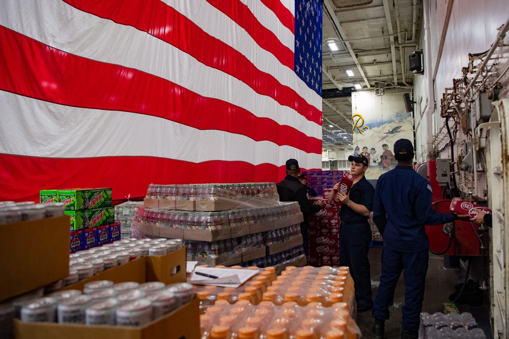 USS Ronald Reagan (CVN 76) Sailors resupply storerooms