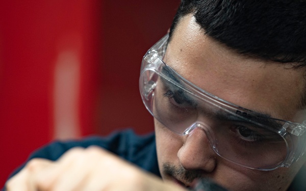 Aviation Structural Mechanic Files Launch Bar Placards in the Jet Shop Aboard USS Carl Vinson (CVN 70)