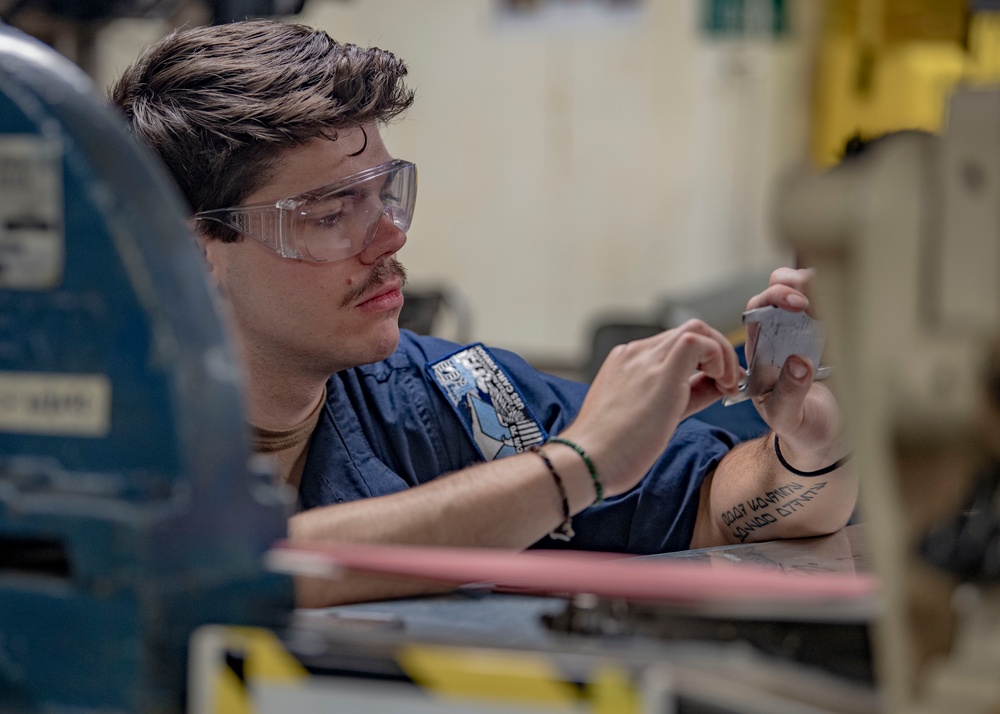 Aviation Structural Mechanic Files Launch Bar Placards in the Jet Shop Aboard USS Carl Vinson (CVN 70)