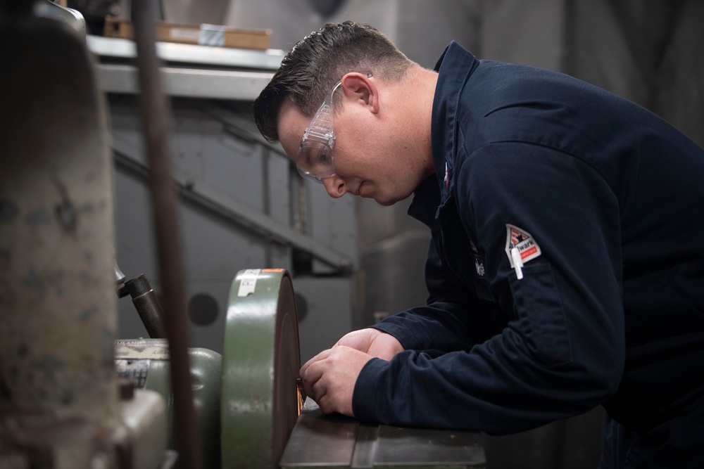 Aviation Structural Mechanic Fabricates a Patch in the Jet Shop Aboard USS Carl Vinson (CVN 70)